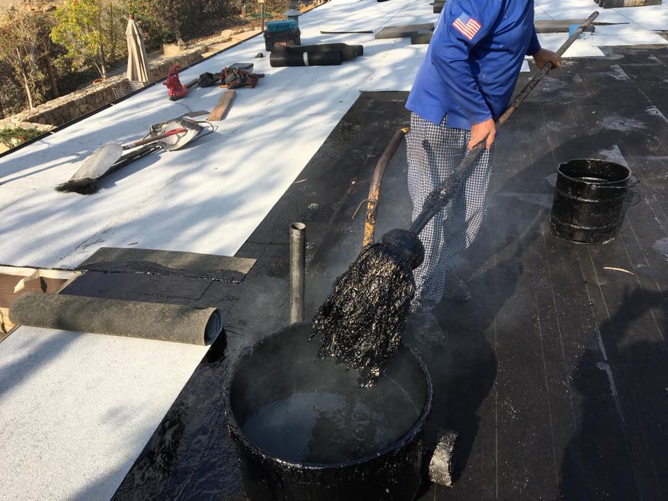 how long does a hot mop roof last? roofing expert installing hot mop roof